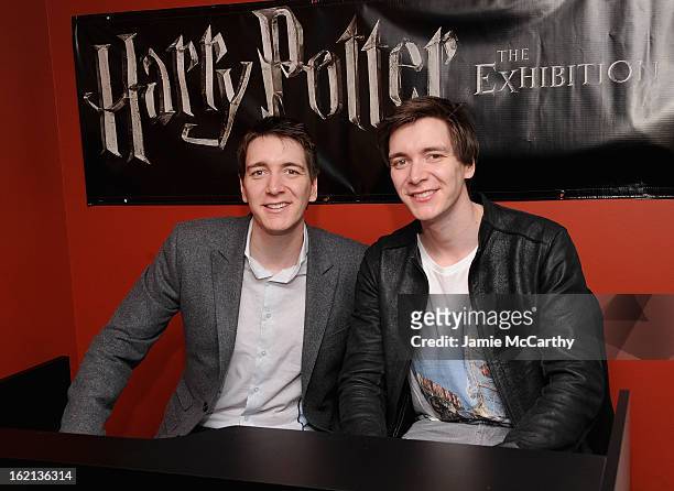 Actors Oliver Phelps and James Phelps visit The Harry Potter Exhibit at Discovery Times Square on February 19, 2013 in New York City.