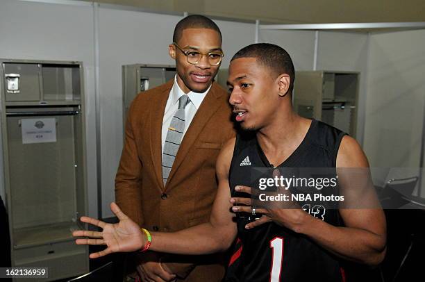 Russell Westbrook of the Oklahoma City Thunder and Nick Cannon of the East team talk during the Sprint NBA All-Star Celebrity Game in Sprint Arena at...