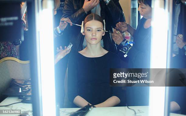 Model has her make up applied backstage at the Roksanda Ilincic show during London Fashion Week Fall/Winter 2013/14 at The Savoy on February 19, 2013...