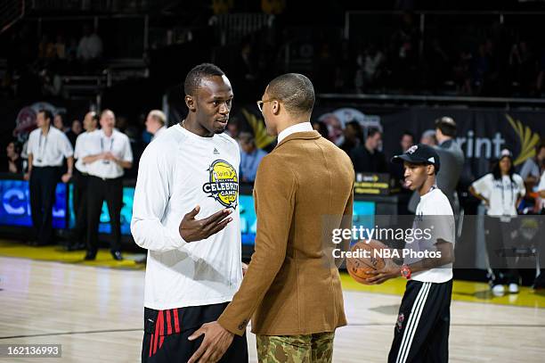 Sprinter Usain Bolt and Russell Westbrook of the Oklahoma City Thunder talk during the Sprint NBA All-Star Celebrity Game in Sprint Arena at Jam...