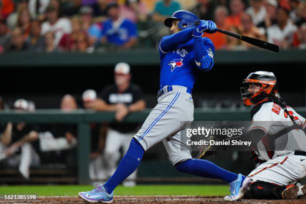 George Springer of the Toronto Blue Jays hits a one RBI sacrifice fly in the fourth inning during the game between the Toronto Blue Jays and the...