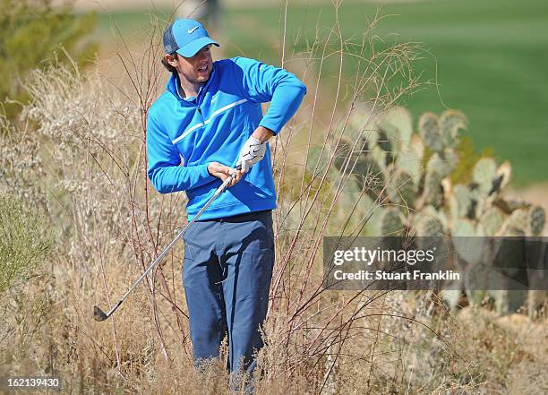 Rory McIlroy of Northern Ireland plays a shot during practice prior to the start of the World Golf Championships-Accenture Match Play Championship at...