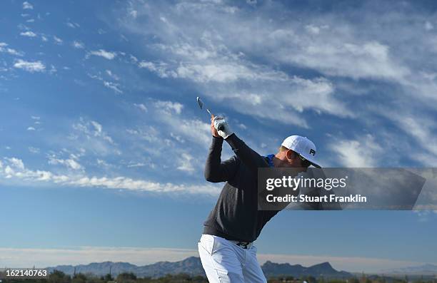 Defending champion Hunter Mahan of USA plays a shot during practice prior to the start of the World Golf Championships-Accenture Match Play...