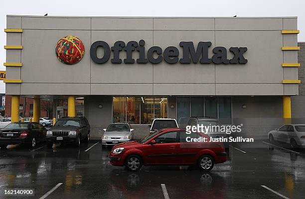 Car drives through the parking lot of an Office Max store on February 19, 2013 in San Francisco, California. Shares for Office Max and Office Depot...