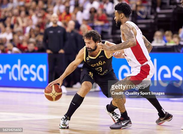 Sergio Llul of the Spain Men's National Basketball Team competes for the ball with Nickeil Alexander-Walker of the Canada Men's National Basketball...
