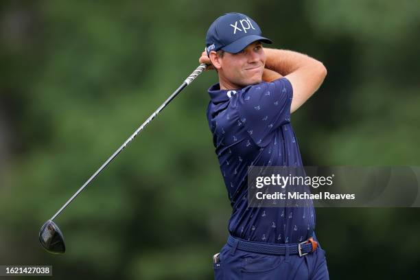 Adam Schenk of the United States plays a shot from the seventh tee during the first round of the BMW Championship at Olympia Fields Country Club on...