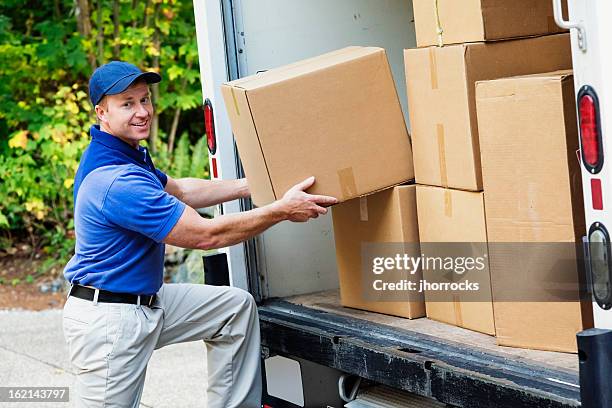 delivery man - physical activity stock pictures, royalty-free photos & images