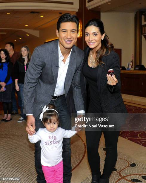 Gia, Mario Lopez and Courtney Mazza announce their new baby at "Extra" at The Grove on February 19, 2013 in Los Angeles, California.