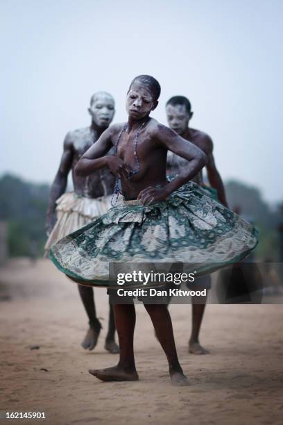 Devotees dance while in a state of trance during a Voodoo ceremony on January 7, 2012 in Ouidah, Benin. Ouidah is Benin's Voodoo heartland, and...