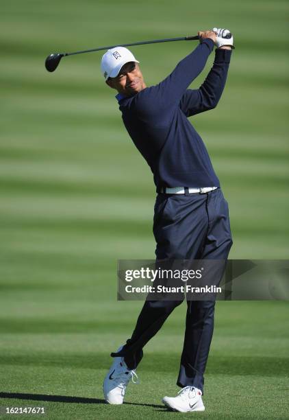 Tiger Woods of USA plays a shot during practice prior to the start of the World Golf Championships-Accenture Match Play Championship at the...