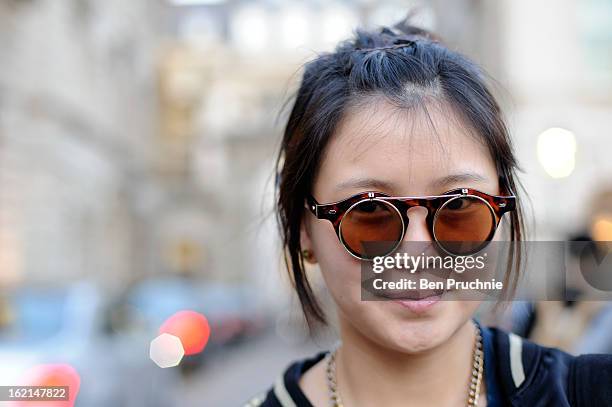 Student Anya poses wearing a Zara jacket, shoes from Marni with unbranded shorts and glasses in Somerset House during London Fashion Week on February...