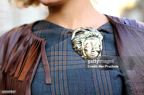 Fashion Designer Tatyana Jordan poses wearing a Zara dress, vintage Versace broach, a handmade jacket with vintage earrings and Christian Louboutin...