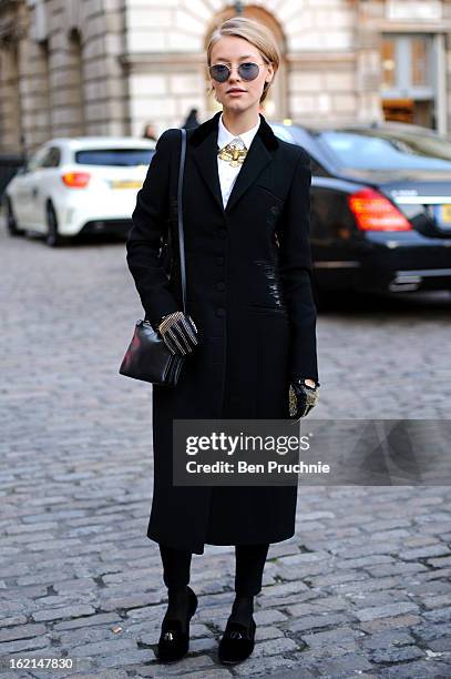 Model/Stylist/Photographer Onatia Romano poses wearing a Botega Venetta coat, Guisepe Zanoti shoes with a Vintage necklace, Celine Shirt, Ralph...