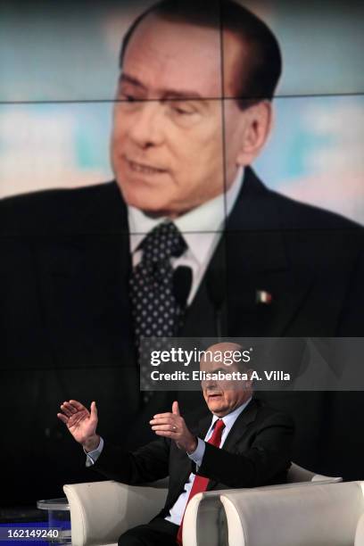 Pier Luigi Bersani, leader of the Italian centre-left Democratic Party attends 'Porta A Porta' TV Show while a portrait of Silvio Berlusconi is...