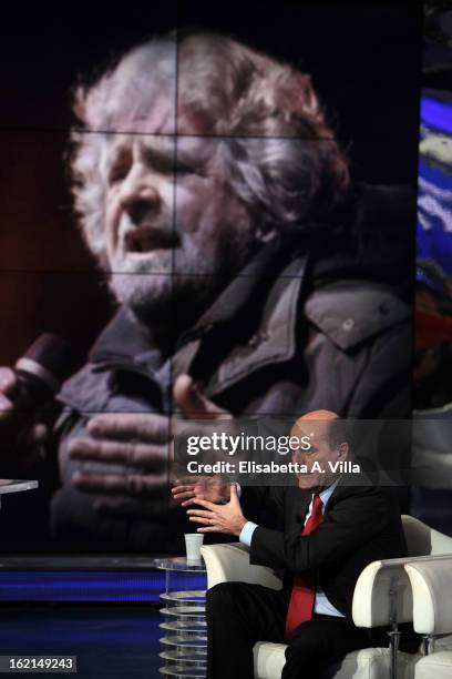Pier Luigi Bersani, leader of the Italian centre-left Democratic Party attends 'Porta A Porta' TV Show while a portrait of Movimento 5 Stelle's...
