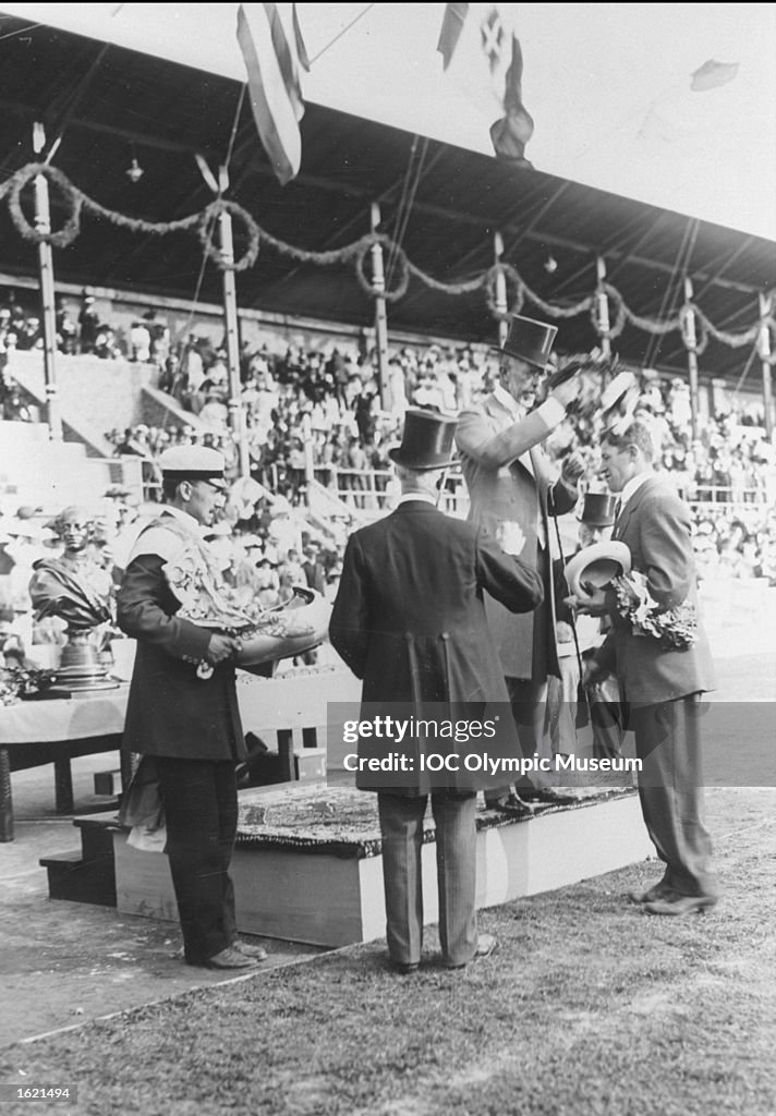 James Thorpe (right) of the USA receiving his gold medal after winning the Decathlon event