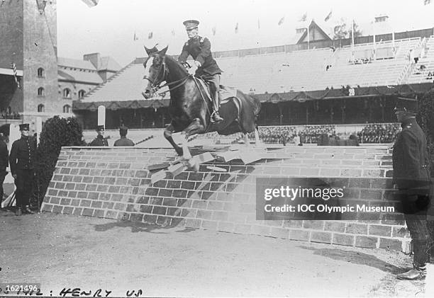 Guy Henry of the USA clearing a fence during the Show Jumping discipline of the Team Three-Day Event competition at the 1912 Olympic Games in...
