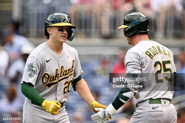 Zack Gelof of the Oakland Athletics celebrates with Brent Rooker after hitting a home run against the Washington Nationals at Nationals Park on...