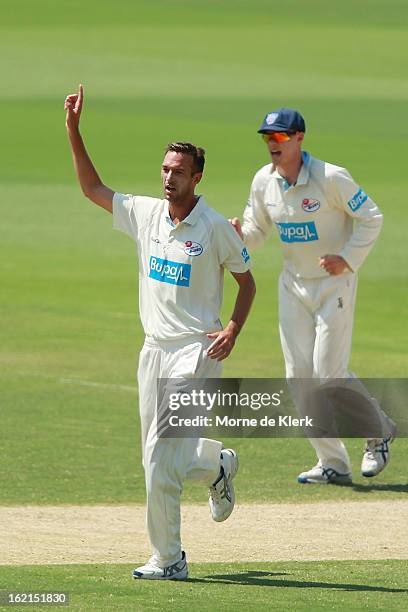 Trent Copeland of the Blues celebrates after getting a wicket during day two of the Sheffield Shield match between the South Australian Redbacks and...