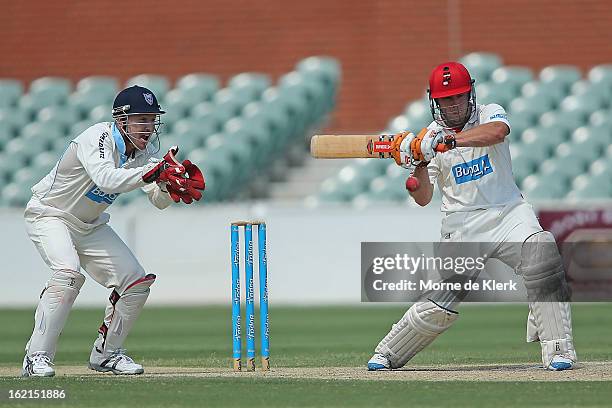 Jake Brown of the Redbacks bats as Brad Haddin of the Blues keeps wicket during day two of the Sheffield Shield match between the South Australian...