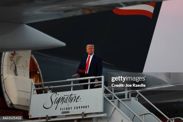 Former U.S. President Donald Trump boards his private airplane, also known as Trump Force One, as he departs Atlanta Hartsfield-Jackson International...