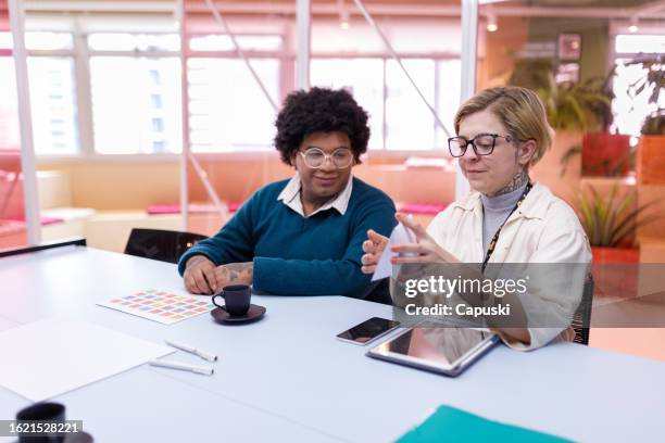 designers checking a product prototype during a meeting - publicidade stock pictures, royalty-free photos & images