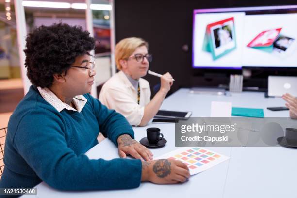 designing team having a product meeting - publicidade stock pictures, royalty-free photos & images