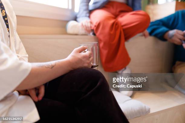 person having coffee during a work break - publicidade stock pictures, royalty-free photos & images