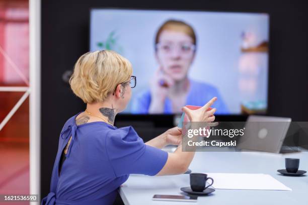 designer showing the product prototype to the client during an online meeting - publicidade stock pictures, royalty-free photos & images