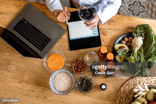 nutritionists desk. view from above. - nutritionist stock pictures, royalty-free photos & images