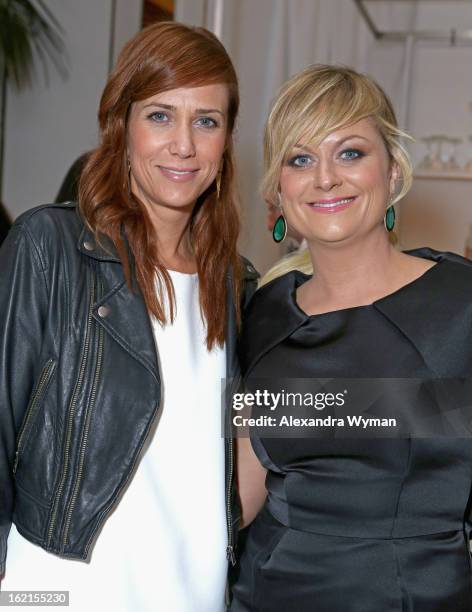 Actresses Kristen Wiig and Amy Poehler attend the 15th Annual Costume Designers Guild Awards with presenting sponsor Lacoste at The Beverly Hilton...