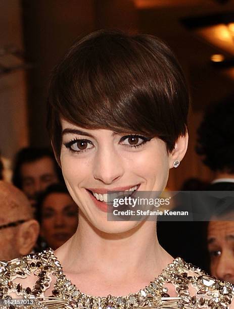 Actress Anne Hathaway attends the 15th Annual Costume Designers Guild Awards with presenting sponsor Lacoste at The Beverly Hilton Hotel on February...