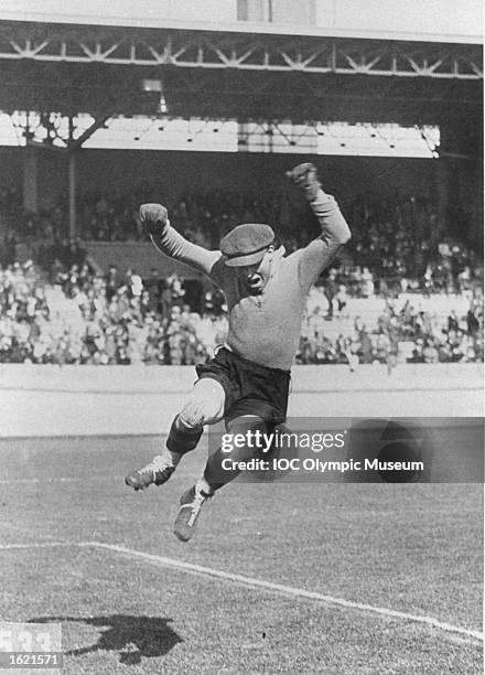 The Belgian goalkeeper airborne during the match between Belgium and Argentina in the Football event at the 1928 Olympic Games in Amsterdam,...