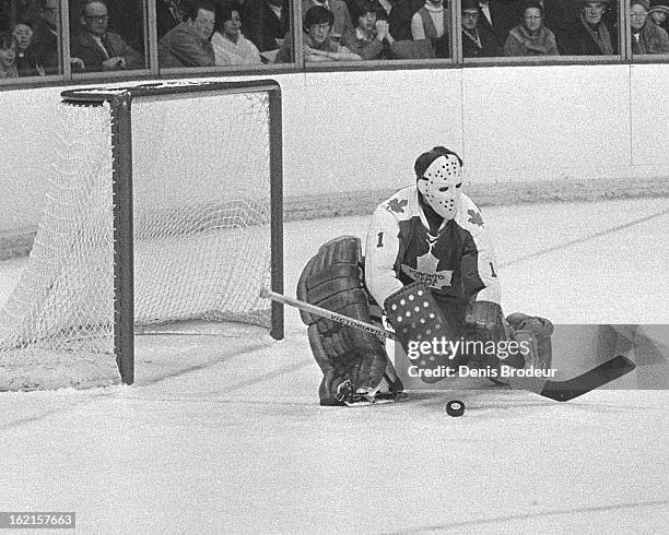Jacques Plante of the Toronto Maple Leafs blocks the puck during a game at the Montreal Forum circa 1971 in Montreal, Quebec, Canada.