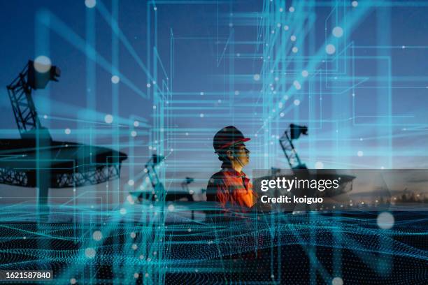 engineer using laptop computer, futuristic technology - blockchain stock pictures, royalty-free photos & images