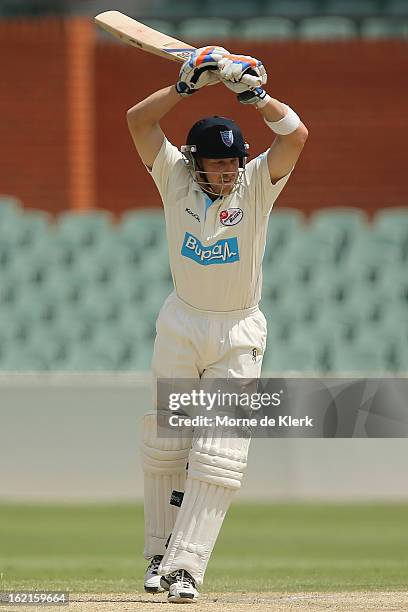 David Dawson of the Blues lets the ball go through to the keeper during day two of the Sheffield Shield match between the South Australian Redbacks...