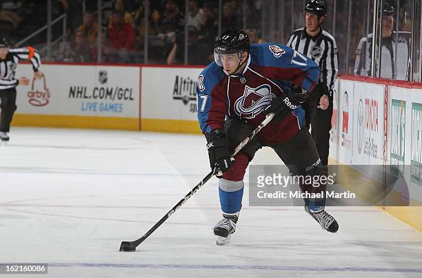 Aaron Palushaj of the Colorado Avalanche skates the puck against the Nashville Predators at the Pepsi Center on February 18, 2013 in Denver,...