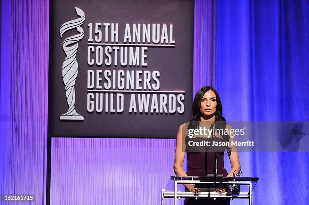 Presenter Famke Janssen onstage during the 15th Annual Costume Designers Guild Awards with presenting sponsor Lacoste at The Beverly Hilton Hotel on...