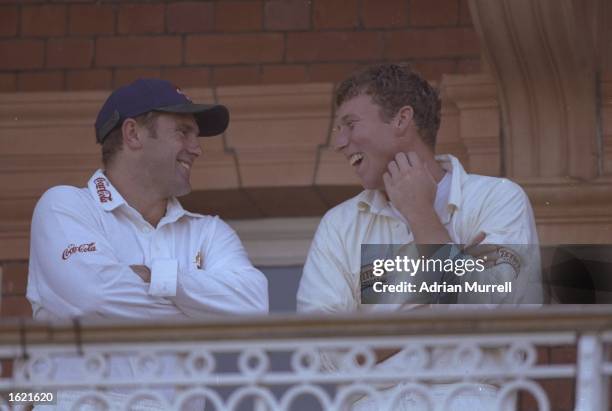 The Ashes captains, Mark Taylor of Australia and Mike Atherton of England share a joke on the balcony during the second test match against Australia...