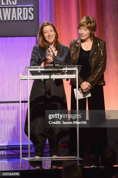 Costume designer Jacqueline Durran accepts award for Excellence in a Period film for 'Anna Karenina' from presenter Shirley MacLaine onstage during...