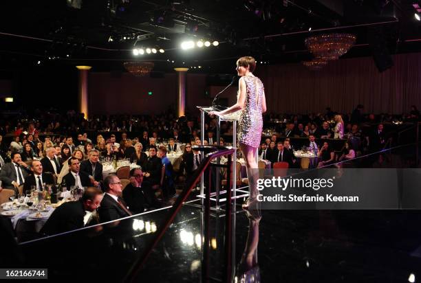 Actress Anne Hathaway accepts the Lacoste Spotlight Award onstage during the 15th Annual Costume Designers Guild Awards with presenting sponsor...