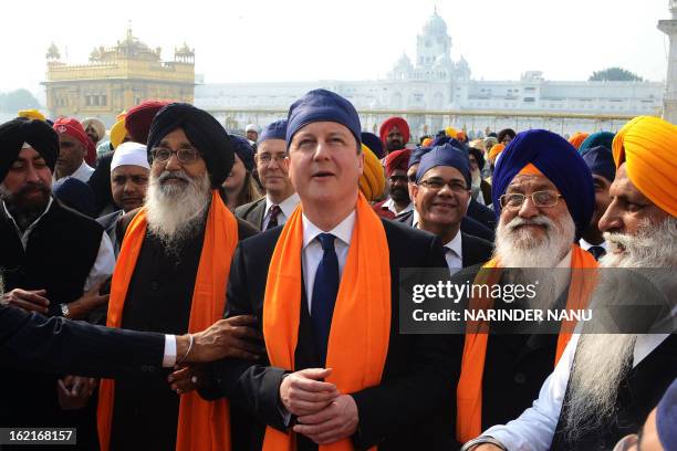 British Prime Minister David Cameron along with Punjab State Chief Minister Parkash Singh Badal , and Shiromani Gurdwara Parbandhak Committee...