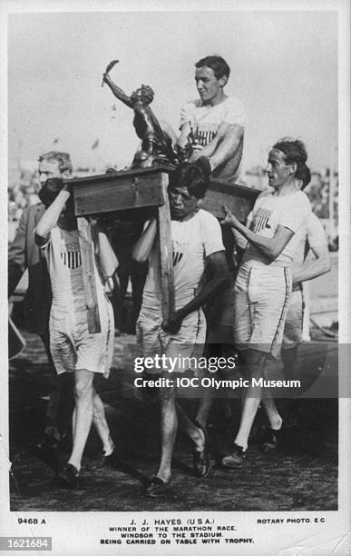 John Hayes of the USA being carried on a table by his team mates after winning the Marathon event during the 1908 Olympics Games in London. \...