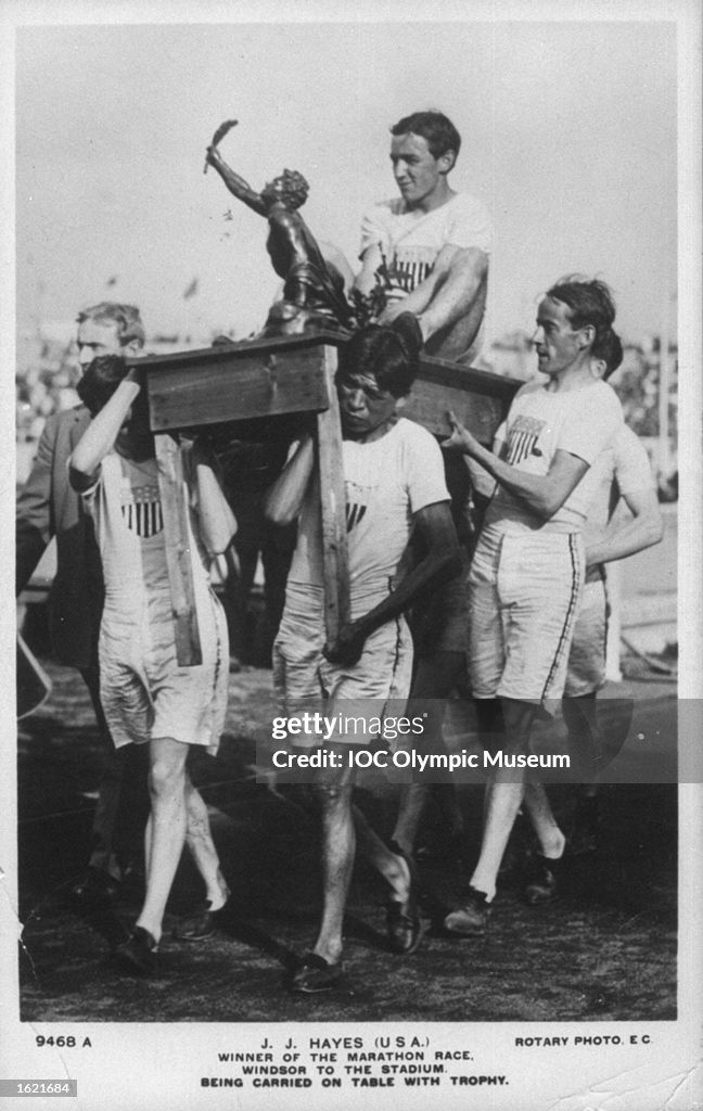 John Hayes of the USA being carried on a table by his team mates after winning the Marathon event