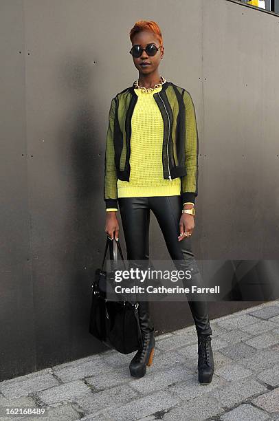 Stylist and blogger Olivia Akot wears an organza style bomber jacket, with neon yellow top from Topshop,accessorised with Go Go Philips necklace,...