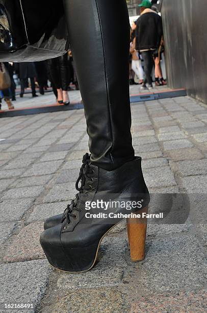 Stylist and Blogger Olivia Akot wears Jeffrey Campbell boots from Festival Shoes in Brick Lane during London Fashion Week Fall/Winter 2013/14 on...