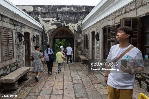 Visitors at the Monte Fort in Macau, China, on Thursday, Aug. 24, 2023. Macau's economy continued to recover, driven by the tourism and gaming...