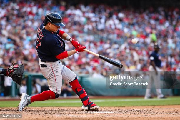 Luis Urias of the Boston Red Sox hits a grand slam home run against the Washington Nationals during the seventh inning at Nationals Park on August...