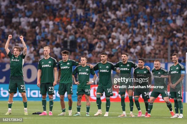 Panathinaikos FC players react during the penalty shoot out of the UEFA Champions League Third Qualifying Round 2nd Leg match between Olympique de...