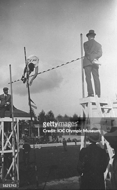 Competitor negotiating the bar in the Pole Vault event during the 1920 Olympic Games in Antwerp, Belgium. \ Mandatory Credit: IOC Olympic Museum...